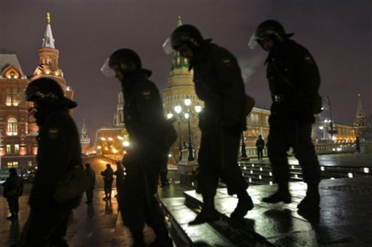 Riot police officers patrol in Manezh square in Moscow, Russia, Wednesday, Dec. 15, 2010, amid fears of a repeat of Saturday's clashes. Parts of Moscow were in police lockdown Wednesday as the city remained jittery over possible ethnic clashes following weekend rioting outside the Kremlin. (AP Photo/Misha Japaridze)